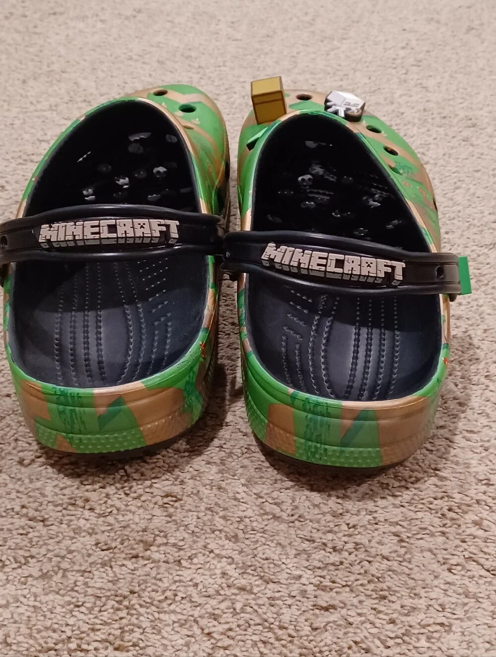 Crocs Minecraft Classic Clogs featuring a green and gold terrain & Jibbitz